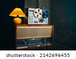 Small photo of Vintage room with Wiretapping on the reel tape recorder. Retro old school spying on conversations. Intelligence gathering. Espionage concept.