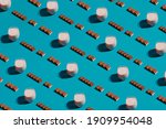 Modern food pattern of chocolate bars and milk on a blue background