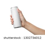 Woman holding aluminum can with beverage on white background, closeup. Space for design