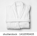 Clean folded bathrobe on white...