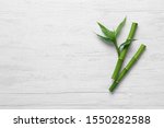 Green Bamboo Stems On White...