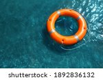 Orange Life Buoy Floating In...