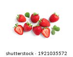 Delicious fresh red strawberries and green leaves on white background, top view