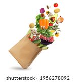 Paper bag with vegetables and fruits on white background. Vegetarian food 