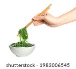 Woman Holding Chopsticks With...