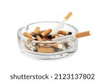 Small photo of Glass ashtray with cigarette stubs isolated on white