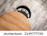 Round wooden table and black...