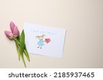 Drawing with text I love you, Mom and beautiful tulips on beige background, flat lay. Space for text
