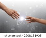 Small photo of Closeup view of people and virtual model of atom on light grey background