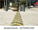 City street with striped plastic speed bump