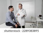 Patient having appointment with senior doctor in clinic
