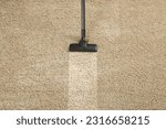 Small photo of Hoovering carpet with vacuum cleaner, above view and space for text. Clean trace on dirty surface
