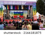 Small photo of SANTA ROSA, CA, U.S.A. - JUNE 4, 2022: Performance stage and audience at Sonoma County pride, with emcee Rock M. Sakura. Sakura is a drag queen from the 12th season of RuPaul’s Drag Race.