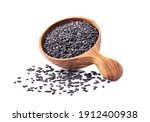 Black Sesame seeds in wooden spoon isolated on white background