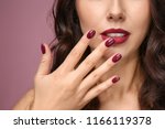 Beautiful young woman with professional manicure on color background, closeup