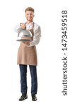 Small photo of Handsome male chef with tray and cloche on white background
