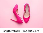 Stylish female shoes on pink background
