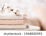 Cotton towels on table in bathroom