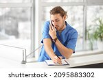 Small photo of Male receptionist working in clinic