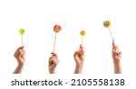 Women holding sweet lollipops...