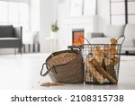 Bag with wood pellets and firewood in living room