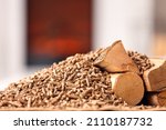 Firewood with pellets in living room, closeup