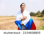 Young Woman With National Flag...