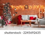 Interior of living room with sofa, Christmas trees and glowing lights