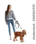 Small photo of Young woman with red cocker spaniel on white background