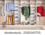 Small photo of Stylish clothes with shoes in boutique
