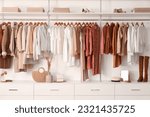 Small photo of Stylish clothes with shoes and accessories in boutique