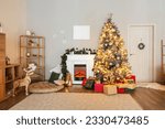 Interior of living room with fireplace, Christmas tree and gifts
