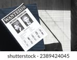 Small photo of Wanted poster in FBI office, top view