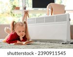 Cute little girl reading book...