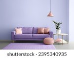Interior of modern room with comfortable lilac sofa and table