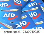 Small photo of Burgdorf, Lower Saxony, Germany - July 9, 2023: Paper flags with the logo of the right-wing political party Alternative for Germany, AfD