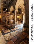 Small photo of Jerusalem, Israel - February 17, 2013: Pilgrims praying near Stone of Unction at entrance in Church of the Holy Sepulchre