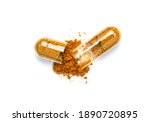 Turmeric herbal powder capsules isolated on white background. Top view. Flat lay.