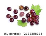 Red grapes with green leaves and half sliced isolated on white background. Top view. Flat lay. Grape pattern texture background. 