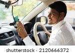 Small photo of Cab driver using map navigation or gprs on mobile phone for travelling - cocnept of technology, smartphone and internet