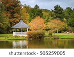 Small photo of Gazebo in the park surrounded by fall foliage at Mayview Lake in Broyhill Park, Blowing Rock, North Carolina in autumn.