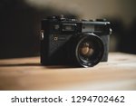 Small photo of Dubai, uae - jan 25 2019: vintage antique camera on wooden table , yashica electro 35 gtn