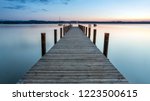 Small photo of Sunset atmosphere with a view on landing stage, at lake Starnberg