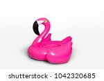 Pink, trendy, blown beach flamingo isolated on white background. Hit the summer. Pink flamingo. Pink flamingo, tropical bird shape inflatable for swimming pool.
