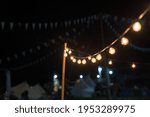Luminous Light Bulb At Campsite