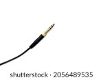 Stereo audio headphone jack with cable on white background. Gold jack plug for connecting audio devices and musical instruments.