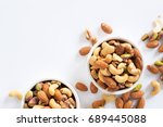mixed nuts in white ceramic bowl 