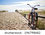 Bike left on sandy beach trail