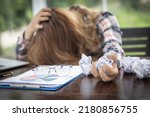 Concept Burnout Syndrome. Woman feels uncomfortable working. Which is caused by stress, accumulated from unsuccessful work, failure to work, Consult a specialist psychiatrist.