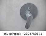 Small photo of Dirty calcified shower mixer tap, faucet with limescale on it, plaque from water, Chrome-plated shower, close up photo.